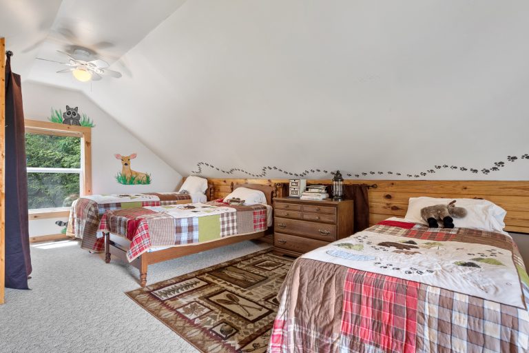 Kids' bedroom with twin beds House in Reed City, Michigan — Lakeside Lodge Retreat, hosted by Roam