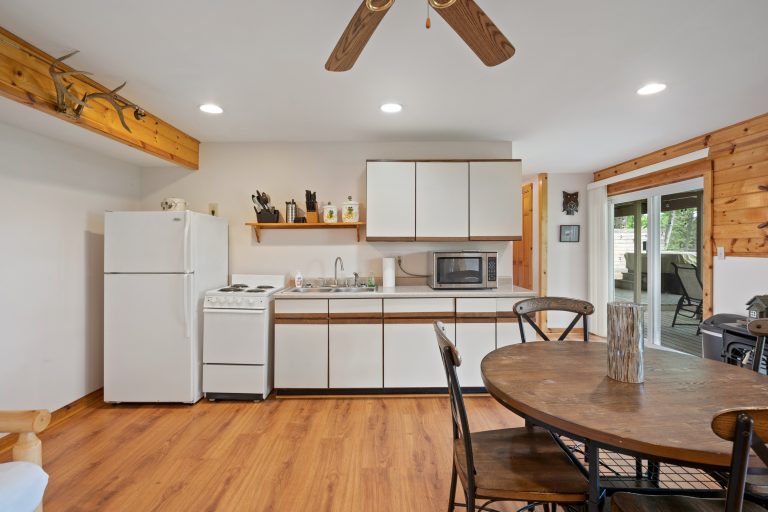 Kitchen and dining area House in Reed City, Michigan — Lakeside Lodge Retreat, hosted by Roam