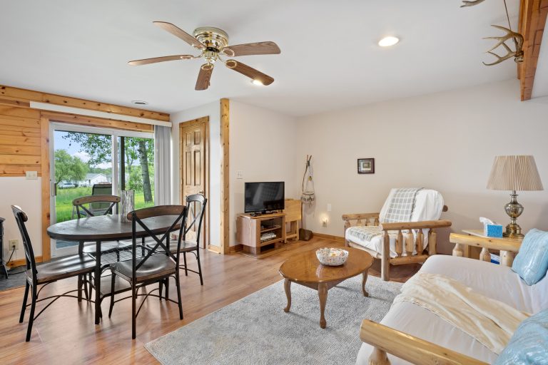 Open living and dining area House in Reed City, Michigan — Lakeside Lodge Retreat, hosted by Roam