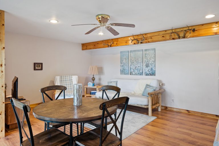 Dining and living area House in Reed City, Michigan — Lakeside Lodge Retreat, hosted by Roam