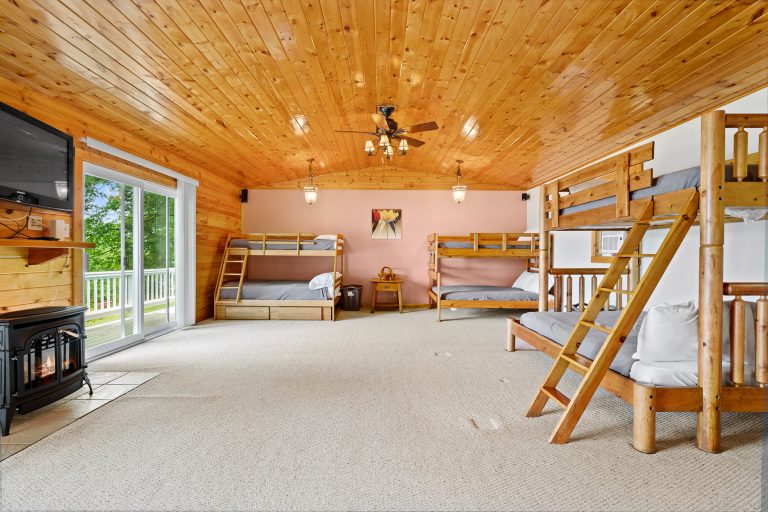 Bunkroom with three bunk beds House in Reed City, Michigan — Lakeside Lodge Retreat, hosted by Roam