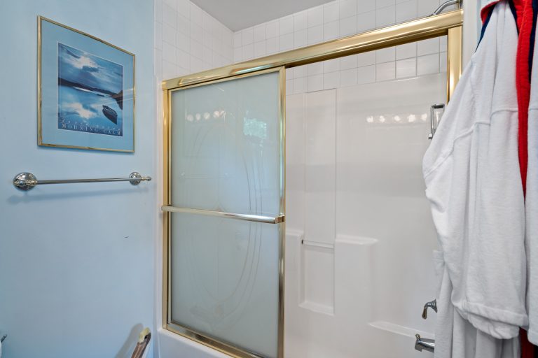 Bathroom with tub-shower combo House in Reed City, Michigan — Lakeside Lodge Retreat, hosted by Roam