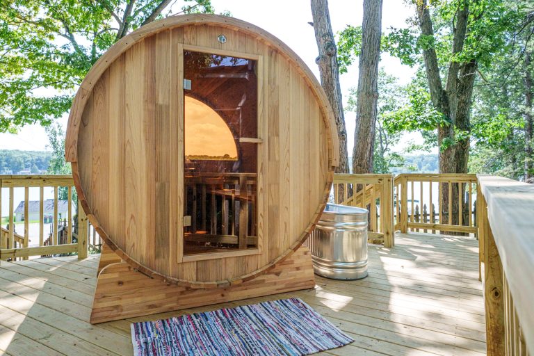 Barrel sauna on the deck Cabin in Mecosta, Michigan — Silent Waters Retreat, hosted by Roam