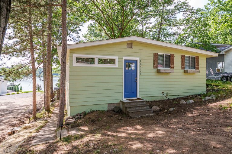 Exterior view near the shoreline Cabin in Mecosta, Michigan — Silent Waters Retreat, hosted by Roam