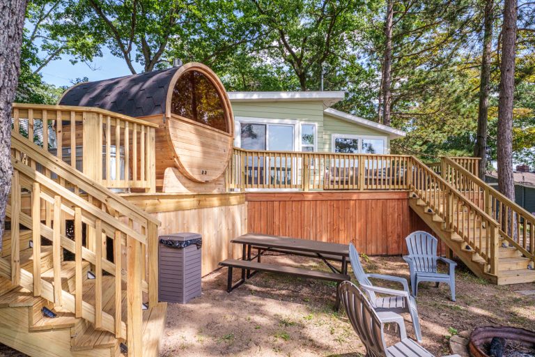 Elevated deck with barrel sauna Cabin in Mecosta, Michigan — Silent Waters Retreat, hosted by Roam