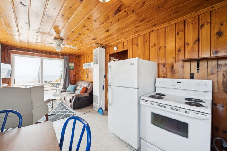 Kitchen and living area with beach view Cabin in Oscoda, Michigan — Barefoot Beach Cabin #4, hosted by Roam