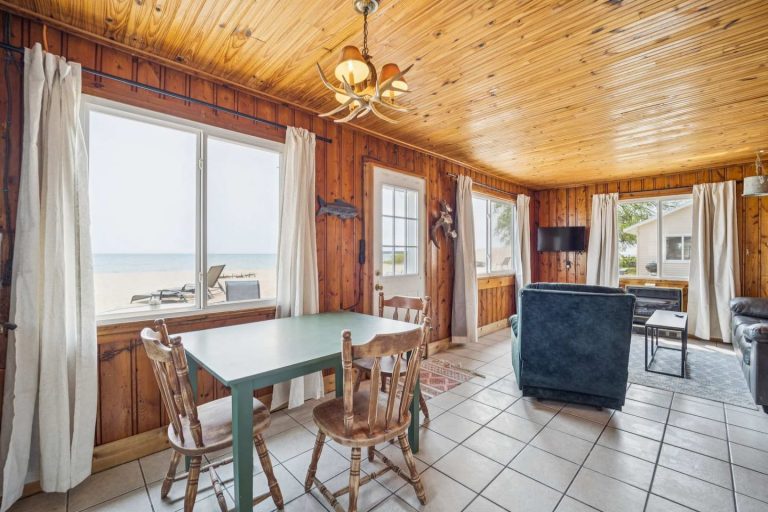 Dining area with beach view Cabin in Oscoda, Michigan — Barefoot Beach Cabin #5, hosted by Roam