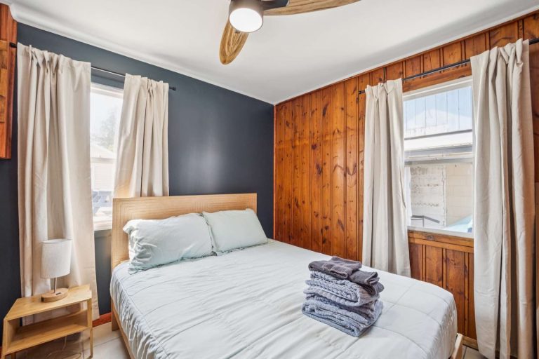 Navy-accent bedroom Cabin in Oscoda, Michigan — Barefoot Beach Cabin #5, hosted by Roam