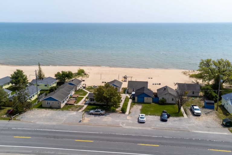 Aerial Lake Huron shoreline Cabin in Oscoda, Michigan — Barefoot Beach Cabin #5, hosted by Roam