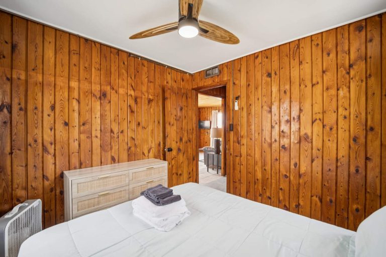 Cozy pine bedroom Cabin in Oscoda, Michigan — Barefoot Beach Cabin #5, hosted by Roam