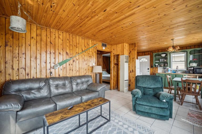 Living room Cabin in Oscoda, Michigan — Barefoot Beach Cabin #5, hosted by Roam