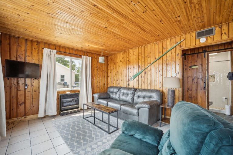 Living room Cabin in Oscoda, Michigan — Barefoot Beach Cabin #5, hosted by Roam