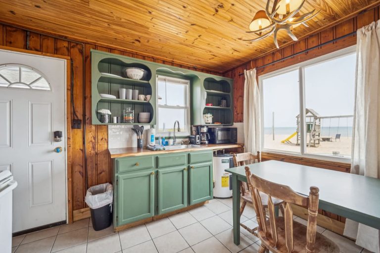 Kitchen with beach view Cabin in Oscoda, Michigan — Barefoot Beach Cabin #5, hosted by Roam