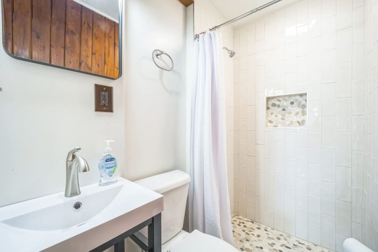 Tiled bathroom Cabin in Oscoda, Michigan — Barefoot Beach Cabin #5, hosted by Roam