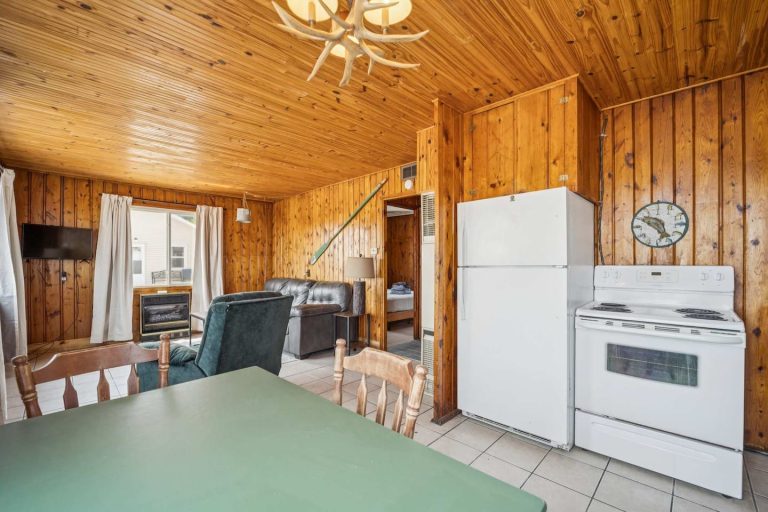 Living-dining room Cabin in Oscoda, Michigan — Barefoot Beach Cabin #5, hosted by Roam