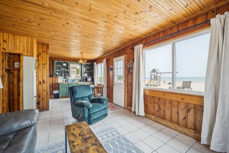 Living room with beach view Cabin in Oscoda, Michigan — Barefoot Beach Cabin #5, hosted by Roam
