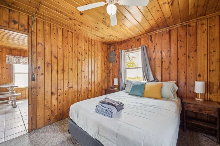 Bedroom with dual nightstands Cabin in Oscoda, Michigan — Barefoot Beach Cabin #7, hosted by Roam