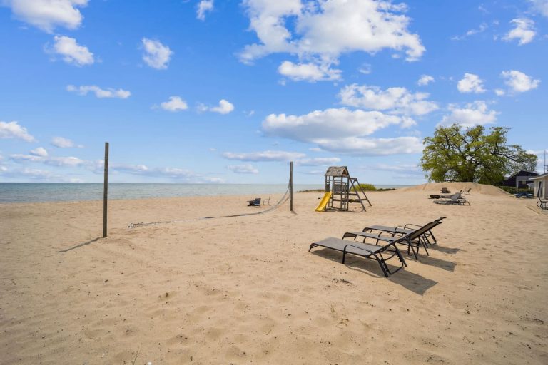 Beach volleyball net and playground Cabin in Oscoda, Michigan — Barefoot Beach Cabin #7, hosted by Roam