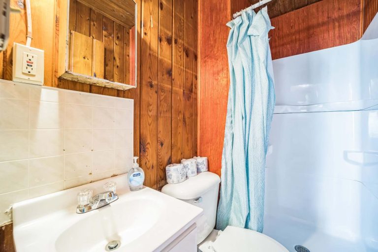 Bathroom with tub and shower Cabin in Oscoda, Michigan — Barefoot Beach Cabin #7, hosted by Roam